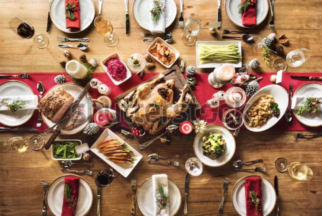 A festive table with Christmas food and drinks, showcasing a holiday feast - stock photo.