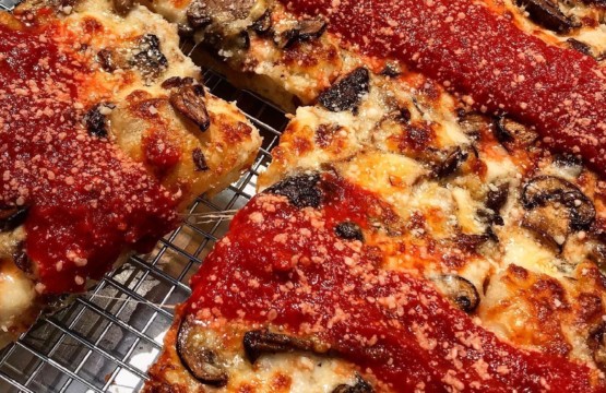 Underground mushroom pizza debuts on a cooling rack in Towson.